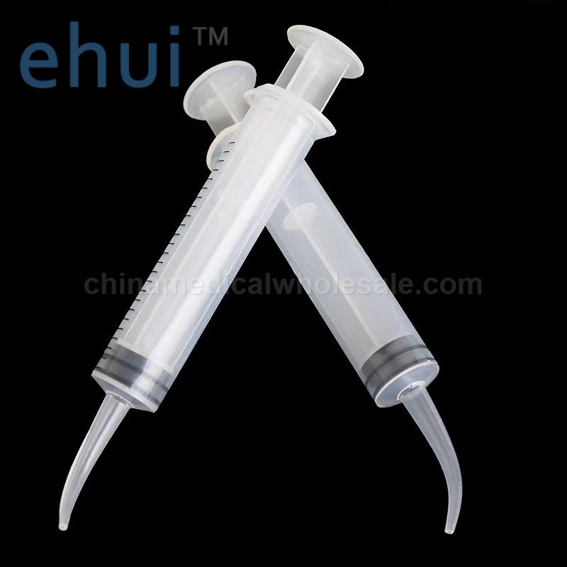 Straight disposable flushing elbow syringe